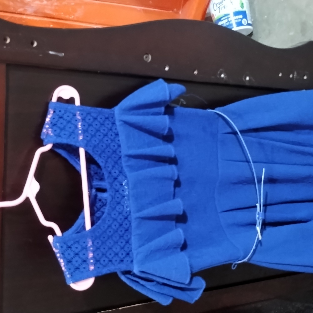A blue party dress with a belt the size is an 8 made by knit works